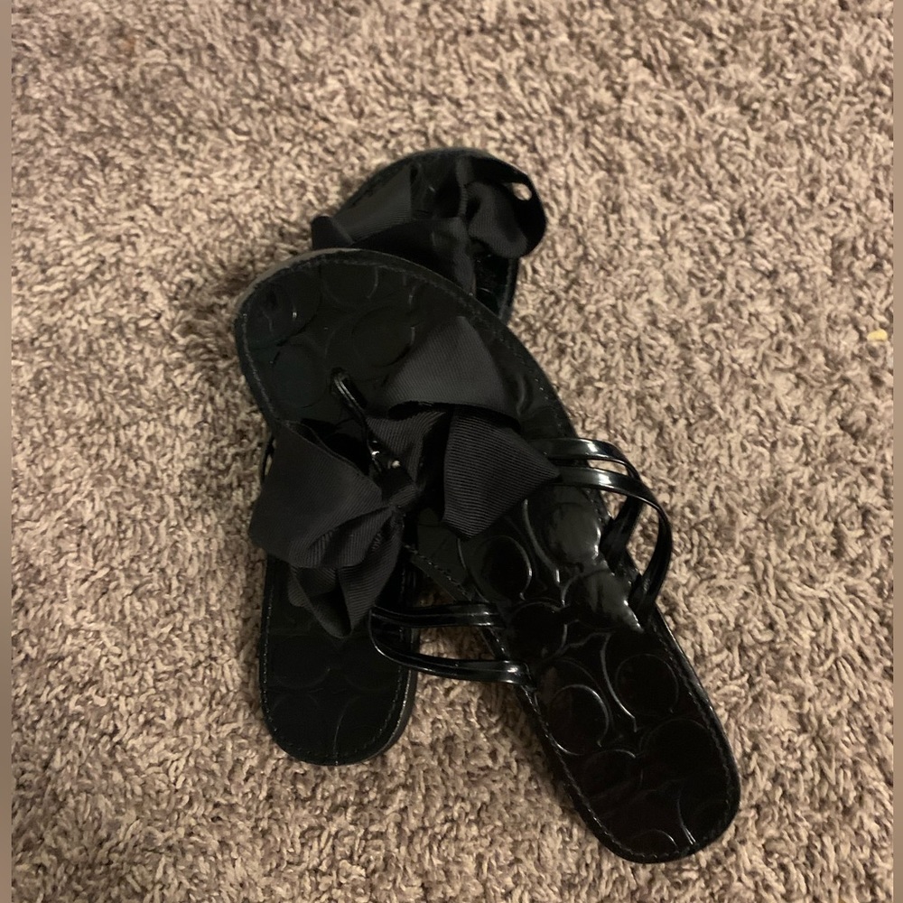 Black coach flipflop/sandals.